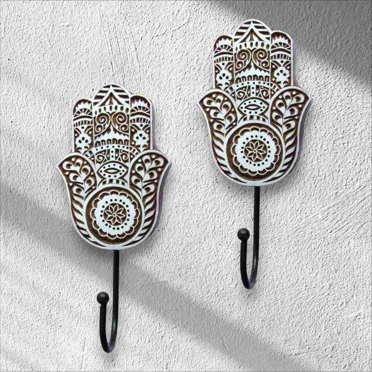 Our Wall hanger hamsa shape feature diverse designs, and handcrafted carvings, offering stylish and functional solutions to suit your specific needs