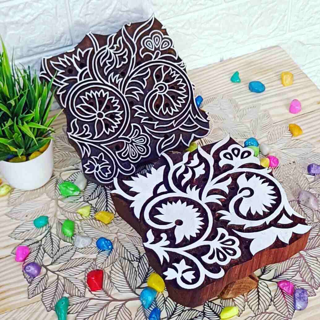 Custom made block print stamps – Handcrafted Tools for Timeless Creations
A Custom made block print stamps is a meticulously handcrafted tool, traditionally used in textile printing, pottery, and paper crafting. Made from premium wood such as teak or sheesham, these stamps are both durable and beautifully designed.
Handcrafted with tradition and expertise
Skilled artisans hand-carve intricate designs onto the Custom made block print stamps, using techniques passed down through generations. The process involves creating raised patterns on the surface, ensuring clean and detailed impressions. Today each block reflects the rich legacy of craftsmanship and attention to detail.
Common uses of Textile printing block
Textile printing: Widely used in fabric printing techniques like traditional Indian block printing, these stamps create intricate and attractive patterns on cloth, paper, and other materials.
Craft projects: Ideal for creating handmade cards, wrapping paper, gift tags, or wall art.
Pottery decoration: Perfect for imprinting designs on clay before firing, adding a unique touch to ceramic pieces.
How to use Custom made block print stamps
Dip the raised surface of the block into dye, paint, or ink, ensuring even coverage.
Press the block firmly onto the desired surface and lift it to reveal the design.
Repeat the process to create a seamless or repeating pattern.
Care Instructions
Maintaining these stamps is simple. After use:
Rinse thoroughly with water to remove any paint or ink residue.
Place the block upside down on a flat surface to air dry. So that there is no inconvenience the next time you print.
Cultural Significance
Custom made block print stamps hold deep cultural importance, especially in traditional textile industries like India’s Kalamkari and other regional printing styles. These blocks are not just tools but also works of art, embodying centuries of artisanal heritage.
Modern Applications
Today, these stamps are cherished for their versatility and artistic value. Beyond their functional use, they serve as decorative items, often collected for their intricate designs and cultural significance.
Whether you’re an artist, crafter, or someone who appreciates traditional craftsmanship, wooden block printing stamps offer endless creative possibilities. Shop now to bring a piece of heritage into your projects!