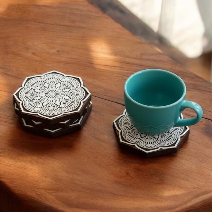 Discover beautifully crafted Wooden rangoli design tea coasters perfect for protecting surfaces and adding a touch of elegance to your table.